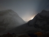 Night time view from Everest Base Camp - the full moon descending behind Nuptse